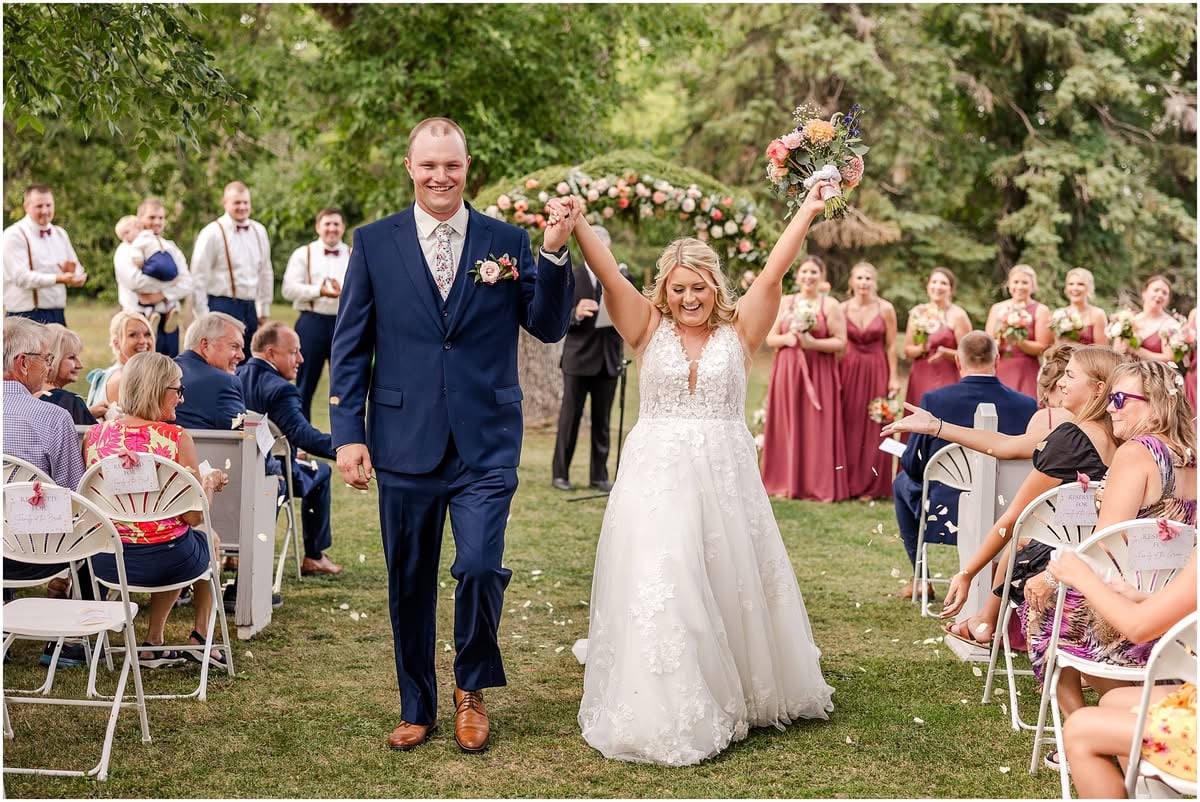 Newlyweds walking down aisle